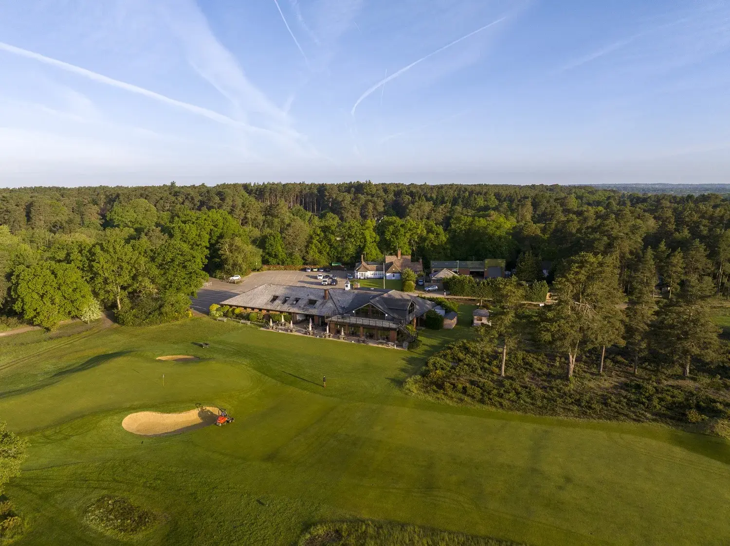 The clubhouse at Hankley Common Golf Club in Surrey, seen across the course at dawn